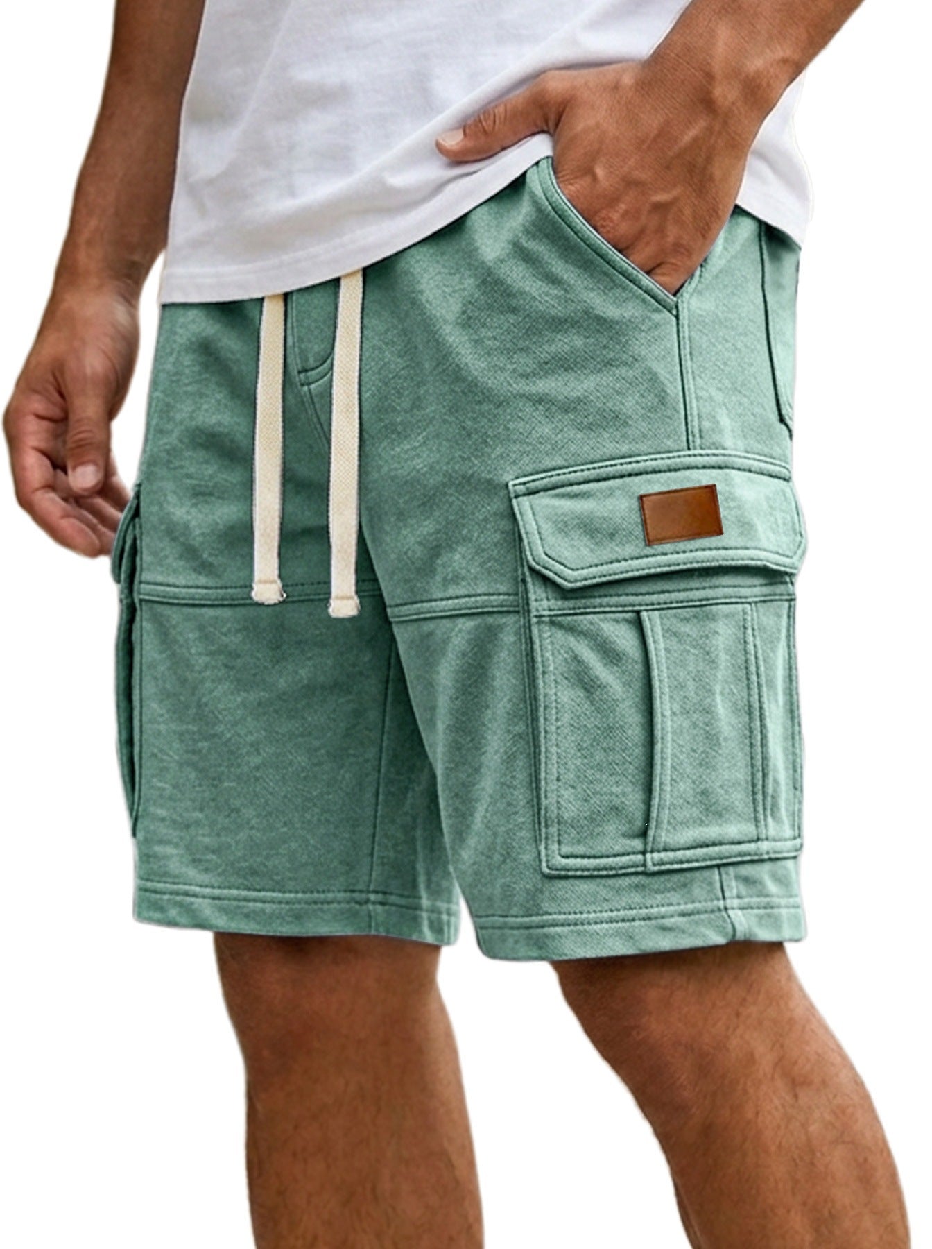 Men's cargo shorts in light green, side cargo pockets with flap and stitched seams