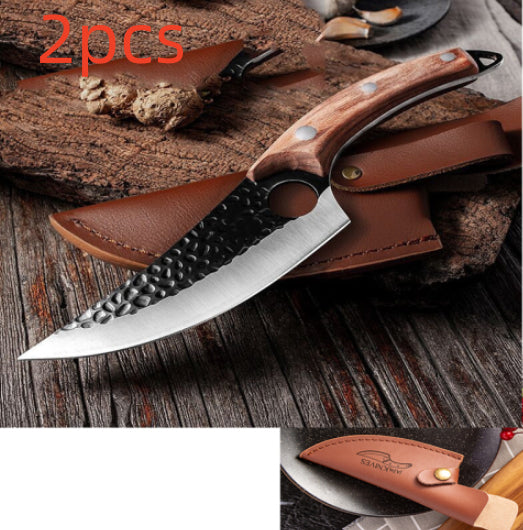 Two boning and scimitar knives with brown handles and brown leather sheath