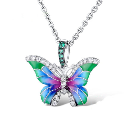 Butterfly enamel pendant necklace with green center stone and multicolor wing enamel
