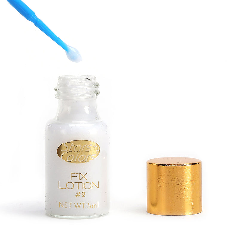 Lash lifting kit fix lotion bottle with blue applicator tip and gold cap