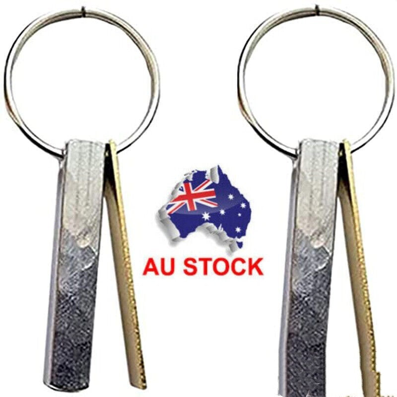 Friendship keychain with round metal ring and two ribbon-like tags in dark and gold.
