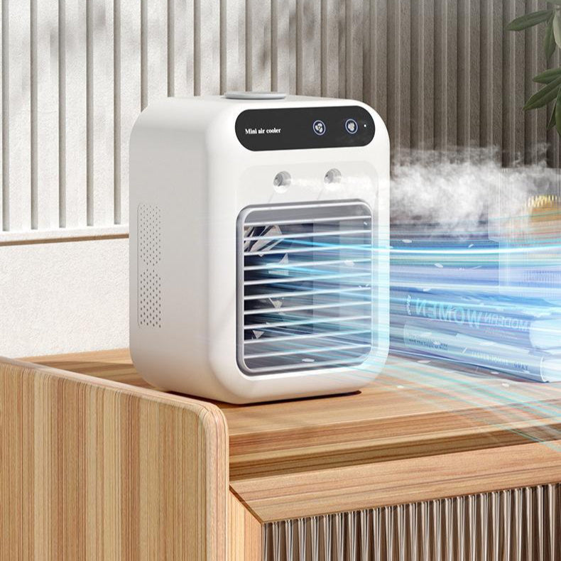 Ivory mini air cooler fan with front grille, top controls, and visible mist stream