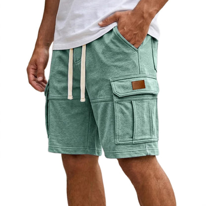Green men’s cargo shorts with flap side pocket and adjustable drawstring waist