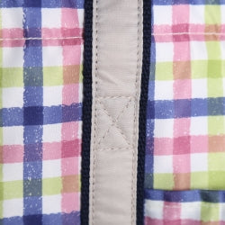 Insulated cooler tote bag close-up of plaid fabric panel and stitched vertical strap