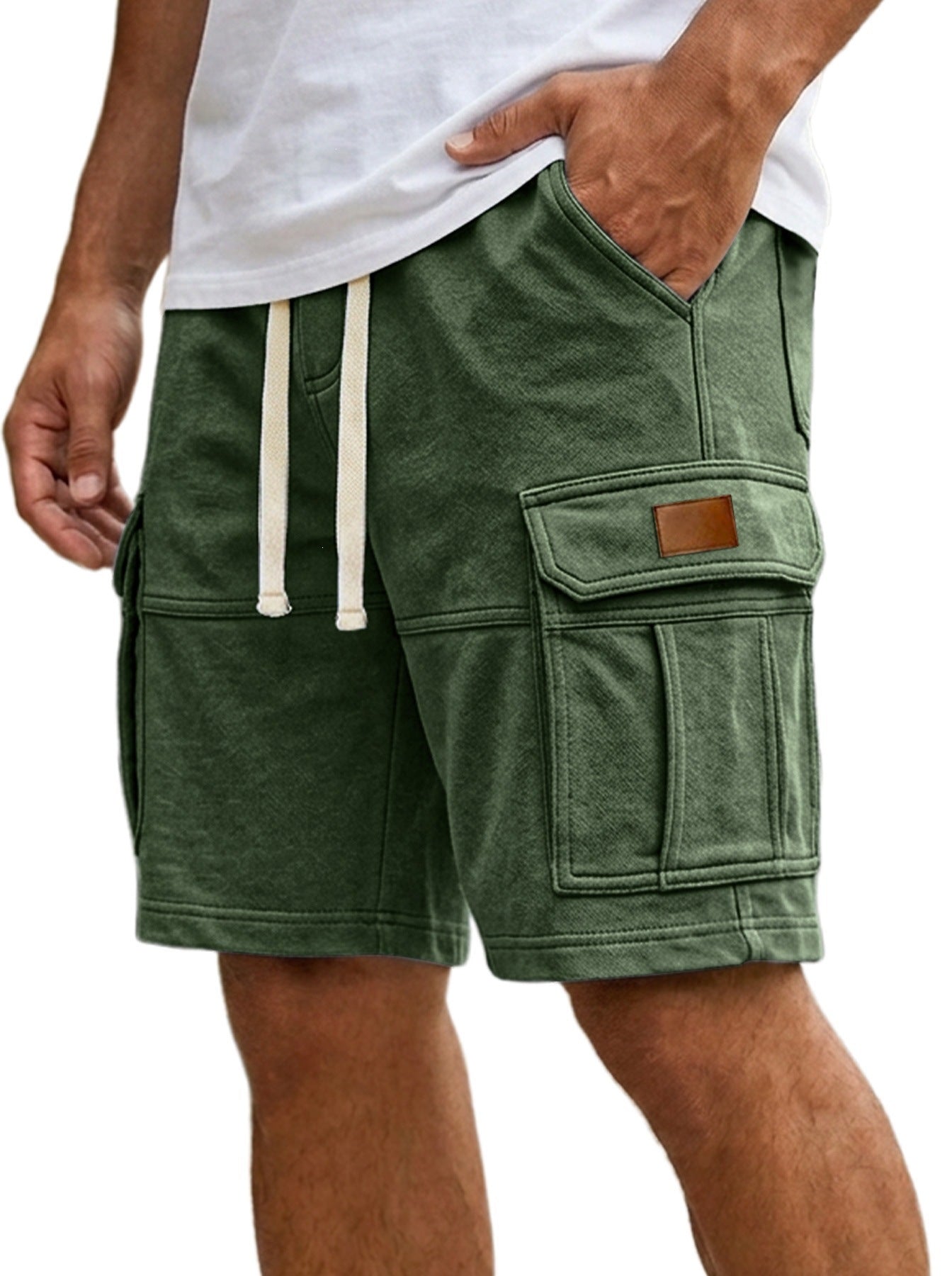 Men's cargo shorts in dark green, side cargo pockets and flap pocket detail