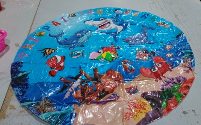 Round inflatable pet cooling water mat with blue dolphin-and-fish graphic